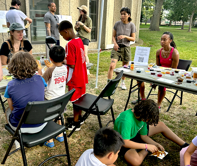 Children and adults at an outdoor event